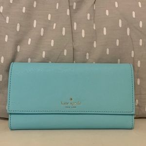 Blue Kate spade wallet with card holder slots